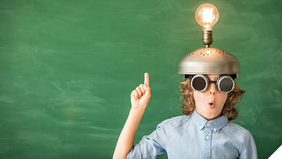 Portrait of child in classroom  Kid with toy virtual reality headset in class  Success, idea and innovation technology concept  Back to school