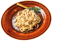 Italian Spaghetti Carbonara pasta with bacon, hard parmesan cheese and cream sauce. Dark Wooden background. top view. Copy space.